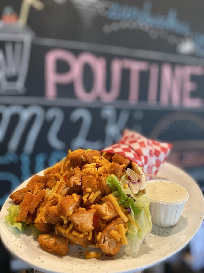 Crispy buffalo chicken salad with cheddar and a side of dressing